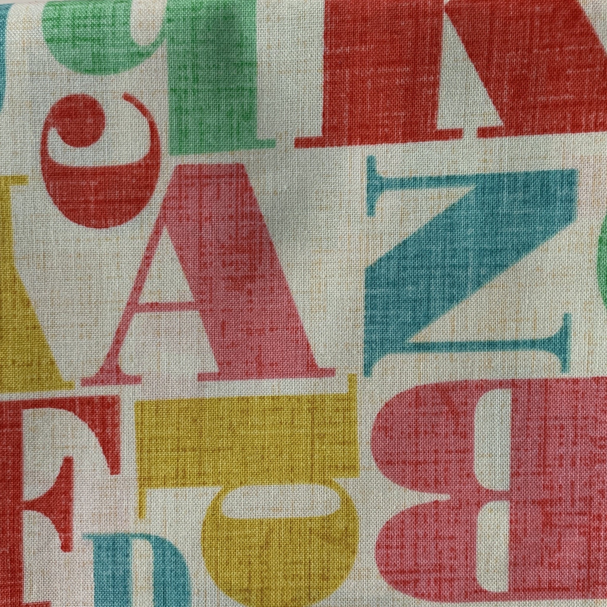 Sale Fabric 31: Multi-coloured Alphabet 1/2m